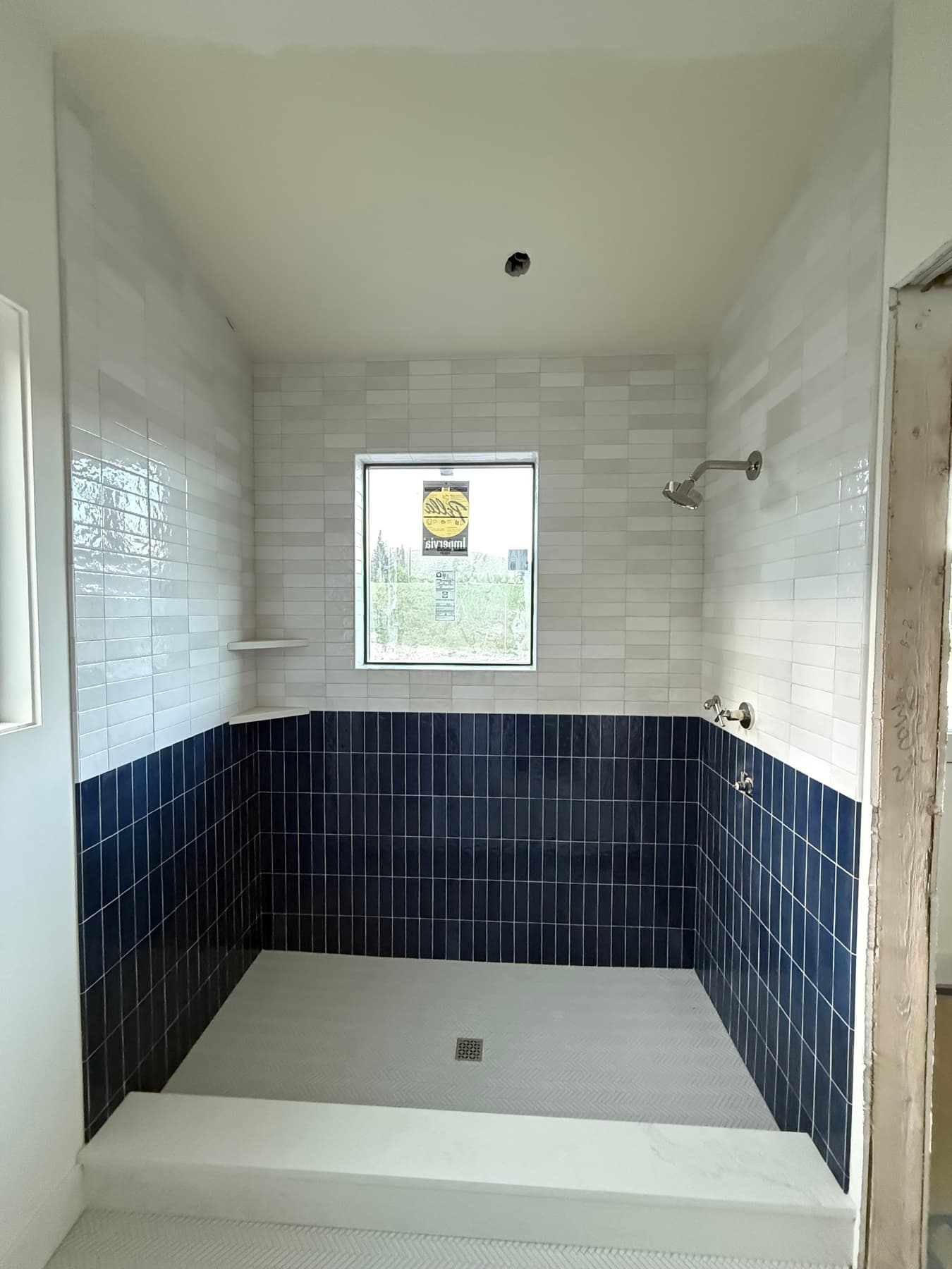Dramatic navy and white tile bathroom