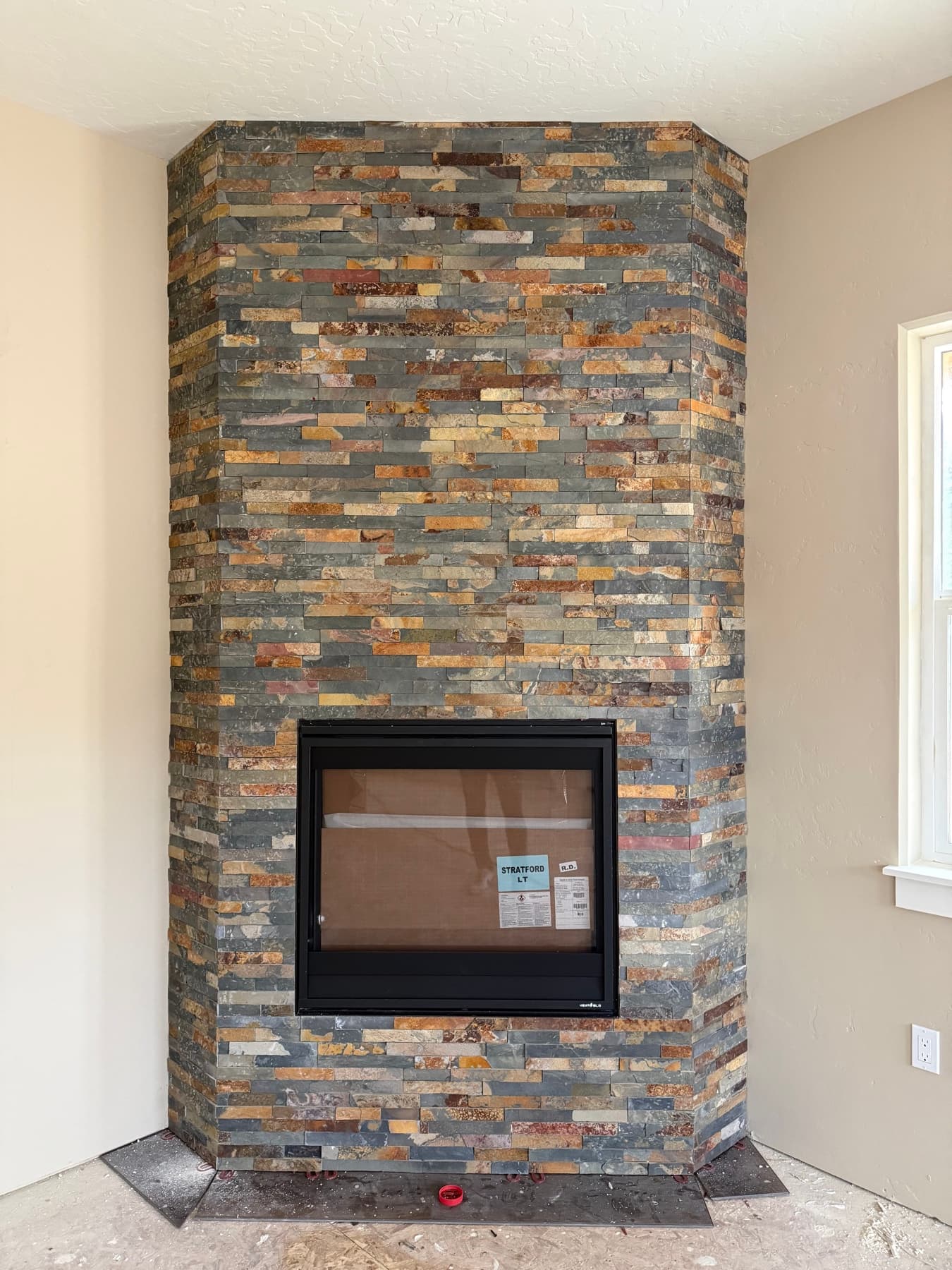 Stacked stone accent wall with a built-in niche