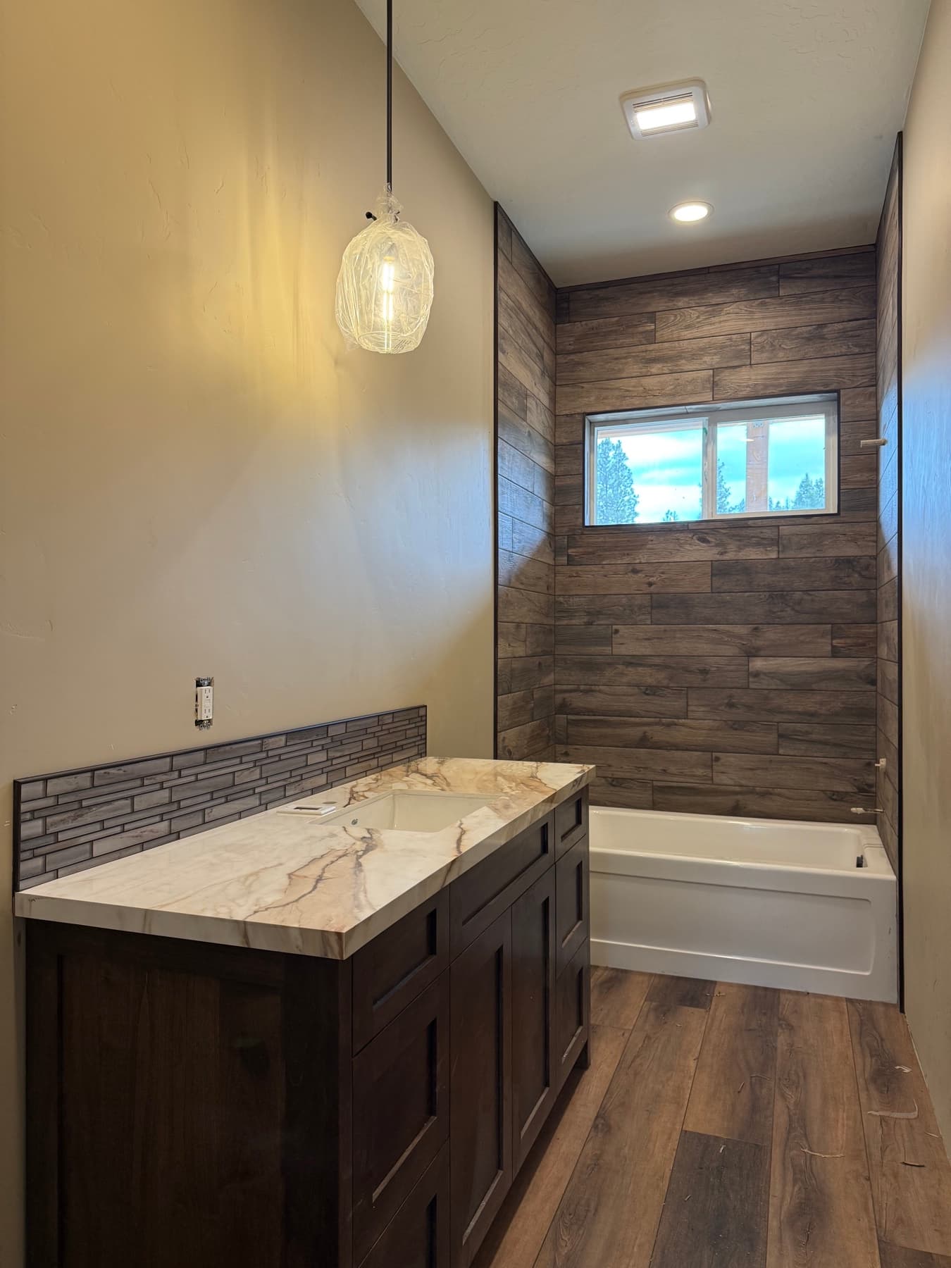 New construction wood-look plank tile flooring in a Treasure Valley home
