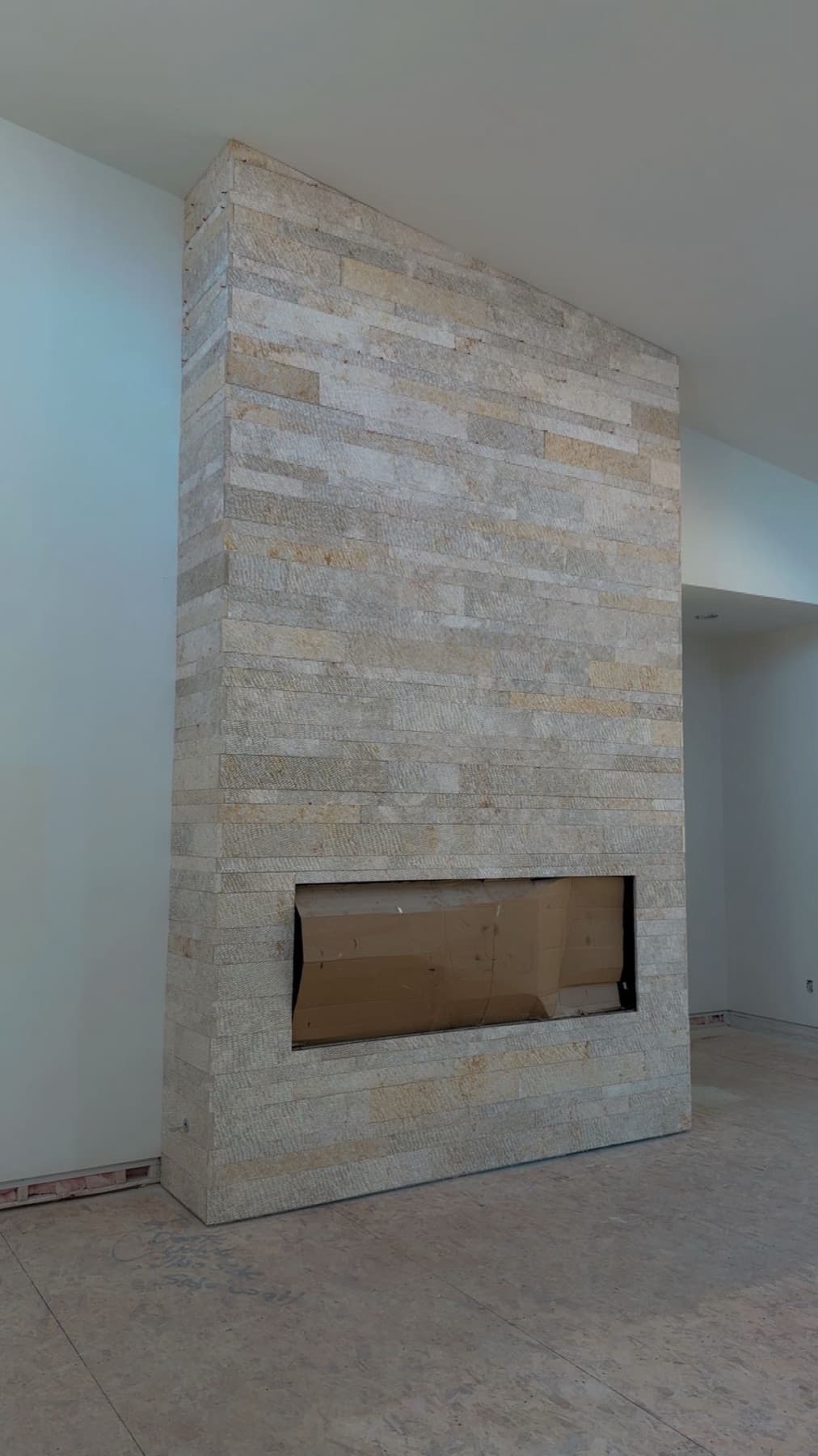 Stacked stone fireplace surround with hearth